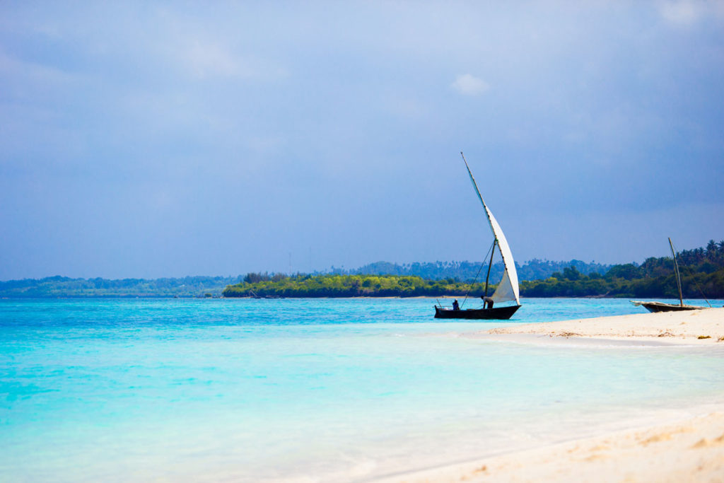 old-wooden-dhow-on-white-beach-in-the-indian-ocean-2023-11-27-05-16-34-utc